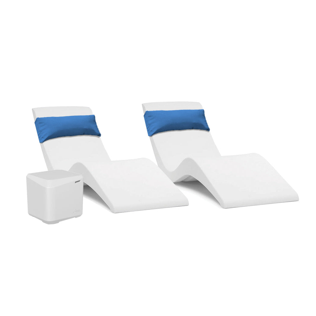 The AquaOutdoors Pool Lounge Chair Set includes two modern white chaise loungers with blue headrests and a small white side table. Their smooth, wave-like curves create a serene aqua vibe on a minimalist white background, ideal for any tanning shelf.