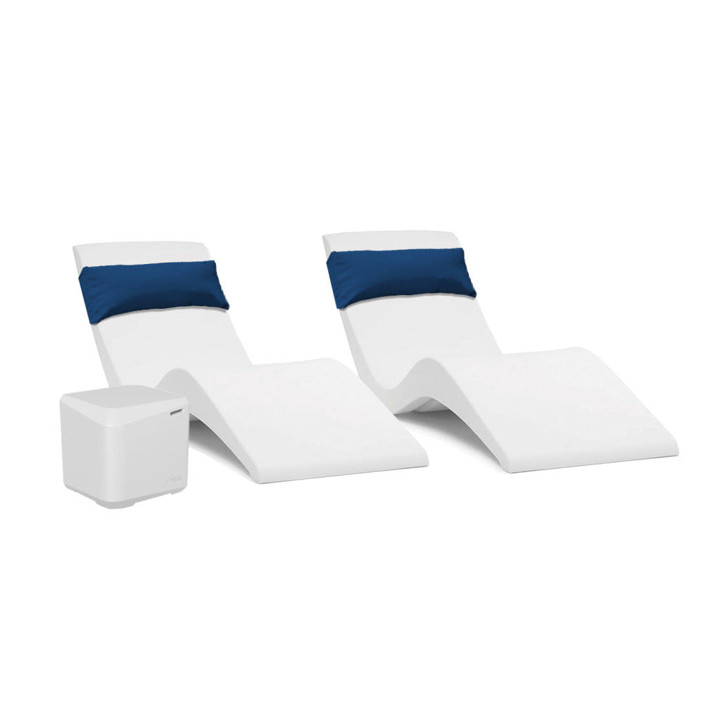The AquaOutdoors Pool Lounge Chair Set features two modern white chaise loungers with blue cushions, showcasing a sleek, curved design ideal for a stylish tanning shelf. The set is completed by a small white cube-shaped table and displayed elegantly on a plain white background.