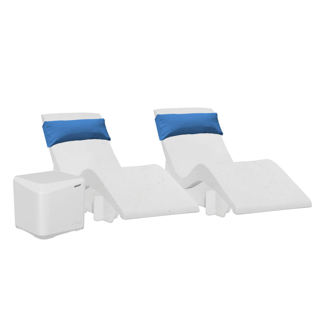 Two white modern chaise loungers with blue headrests from AquaOutdoors Chaise Deep Ledge Bundle are side by side, ideal for a tanning shelf setup. Beside them is a small white cube-shaped cooler or storage unit, all set against a plain white background for a crisp, clean look.