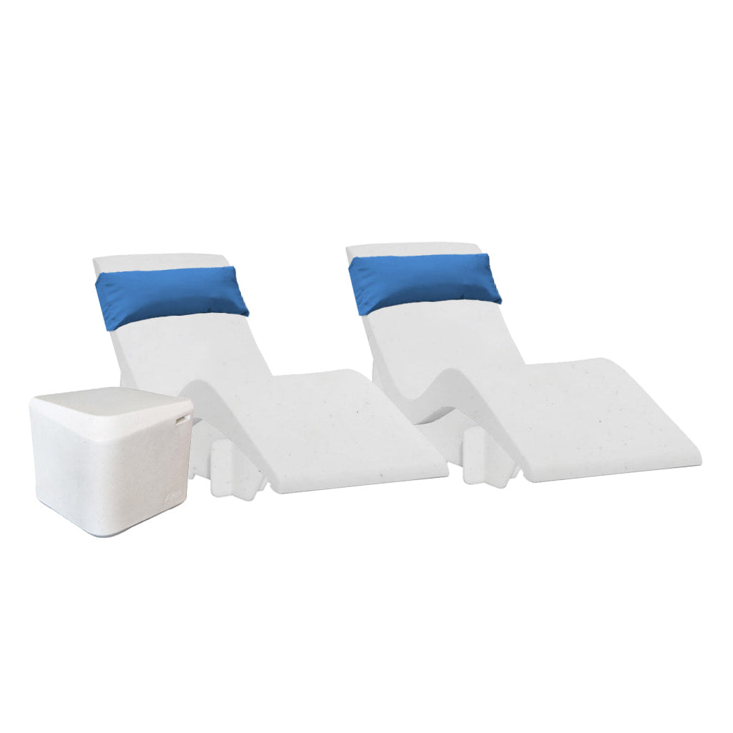 Two white chaise loungers with blue headrests sit side by side on a tanning shelf with a small white square table next to them, forming the ideal AquaOutdoors Chaise Deep Ledge Bundle against a pristine white backdrop.