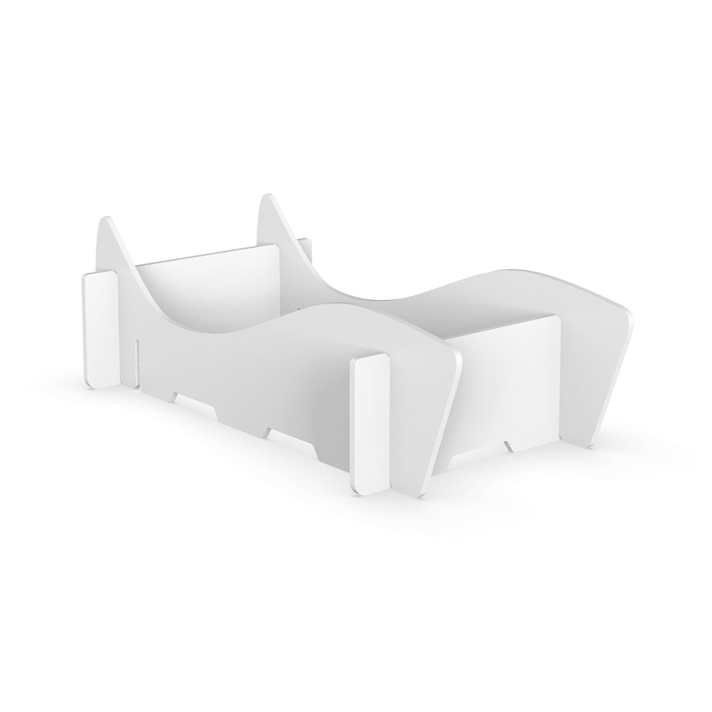 AquaOutdoors’ Chaise Riser is a white, modern minimalist wooden bed frame with smooth, curved edges reminiscent of elegant in-pool lounge chairs. Its low profile features a sleek headboard and footboard on a plain white background.