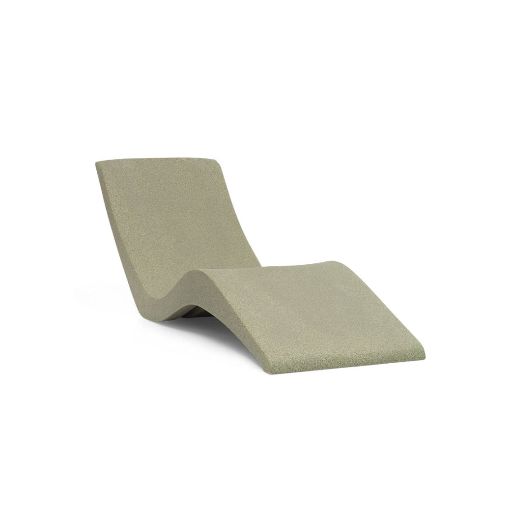 The AquaOutdoors Chaise Pool Lounger features a modern, minimalist design in light green with a smooth, curved shape crafted from solid surface material. Its ergonomic form supports both back and legs, making it ideal for various water depths, and is displayed against a plain white background.
