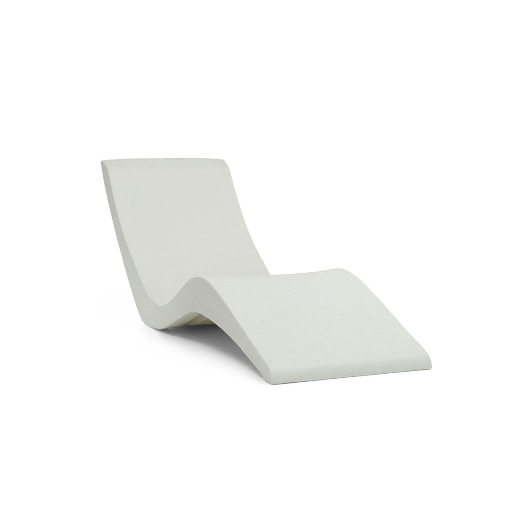 The AquaOutdoors Chaise Pool Lounger features a modern, minimalist design with sleek S-shaped curves in light gray. It offers a sculptural and contemporary appeal on a plain white backdrop.