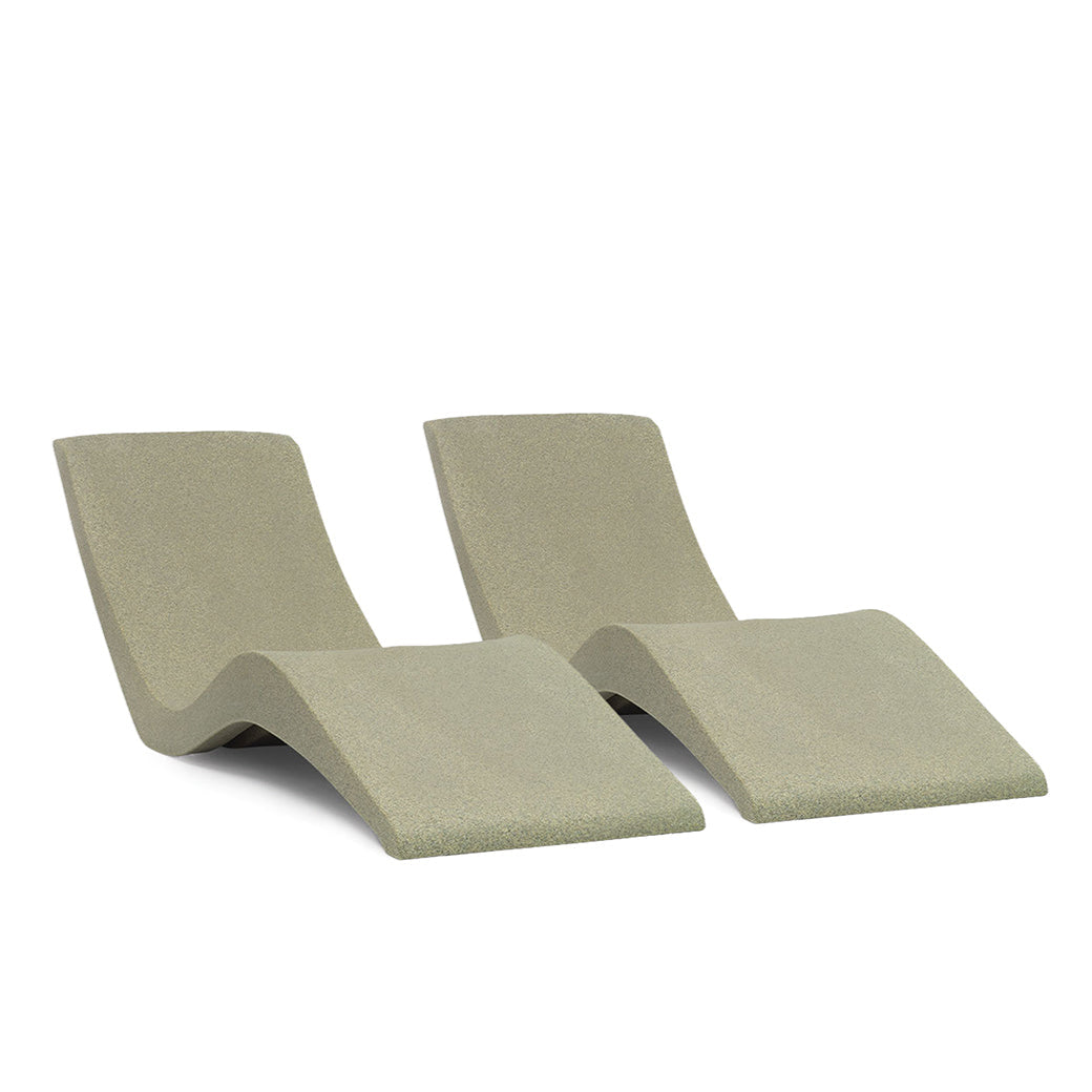 The AquaOutdoors Chaise Lounge Set features two modern, minimalist light green chairs with a smooth, curved design perfect for relaxing. Placed against a white background, they evoke the calmness of sitting by tranquil waters.