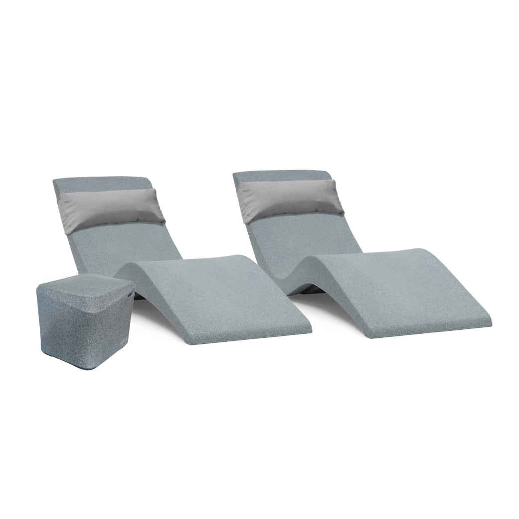 The AquaOutdoors Pool Lounge Chair Set includes two modern gray outdoor chaise loungers with curved designs and rectangular cushions, along with a matching square side table, creating an ideal setting for relaxation.